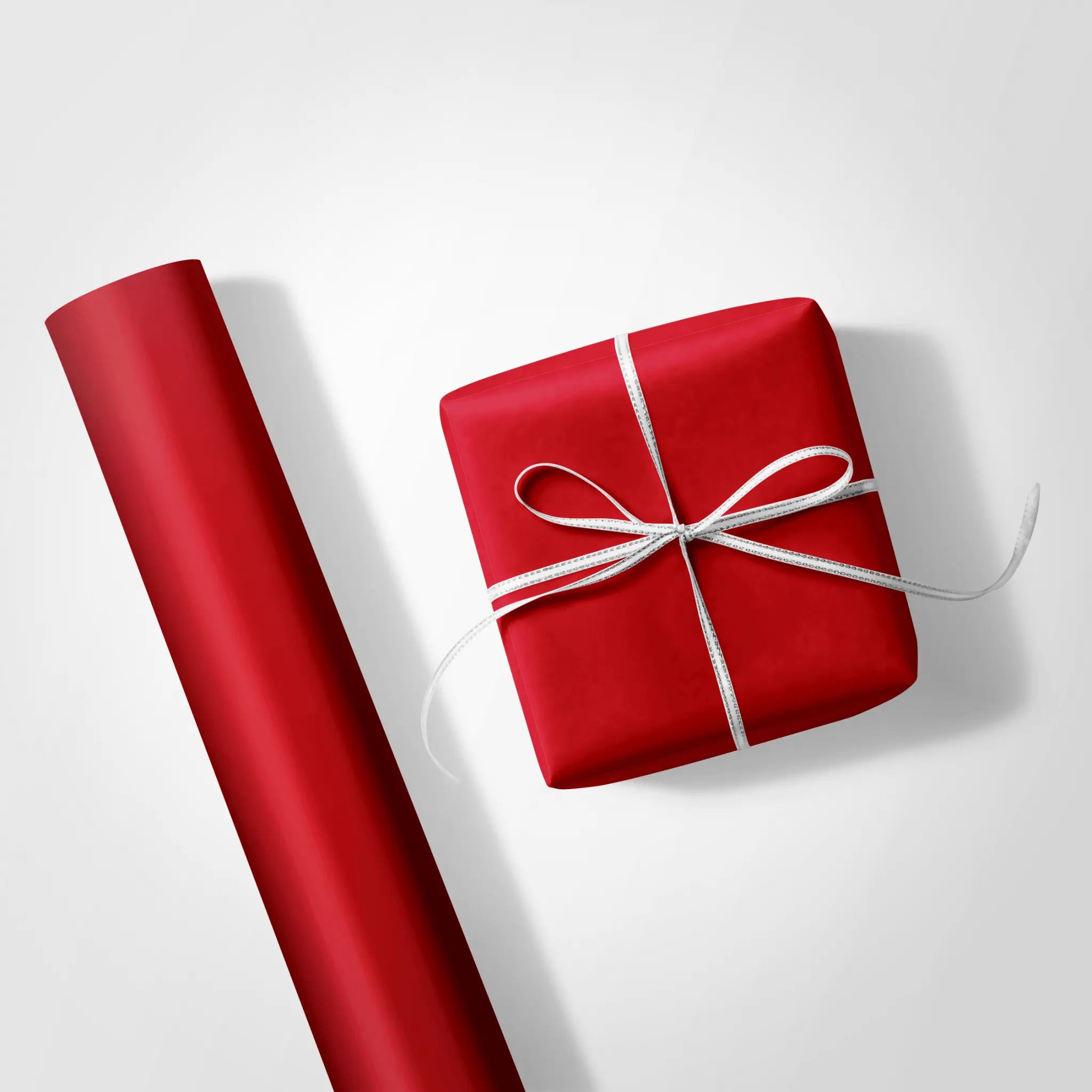 Solid red wrapping paper swatch, ideal for solid color wrapping paper and creating a bold, dramatic background for gifts.