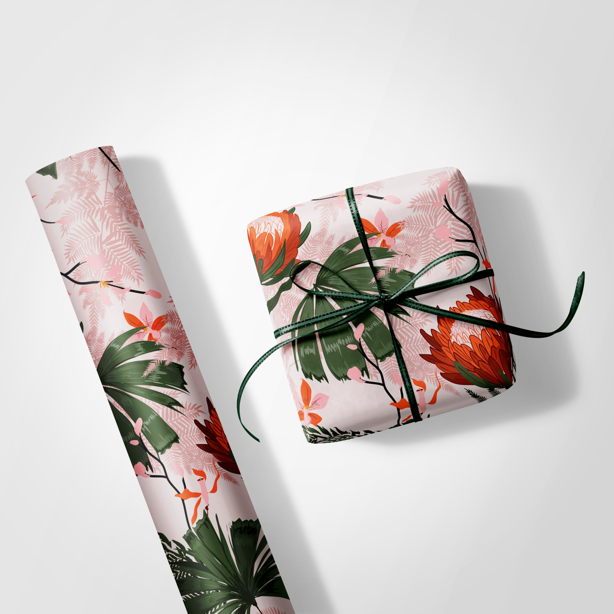 Floral wrapping paper with a wrapped gift on a white background