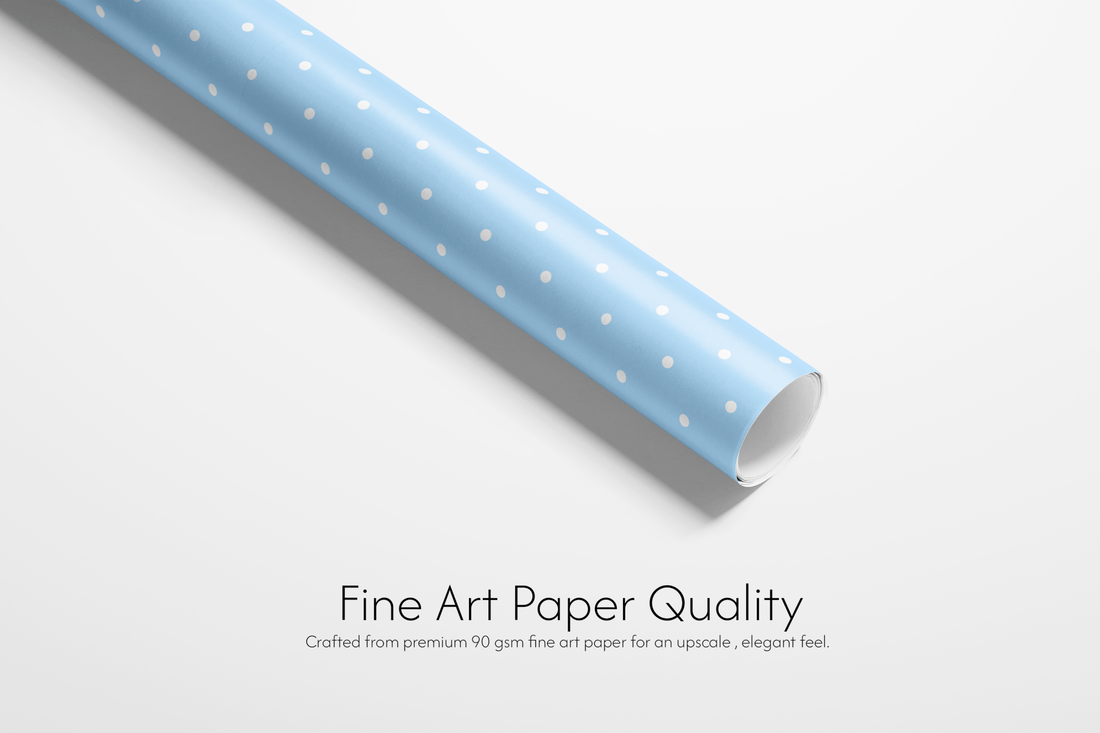 Roll of blue paper with white dots on a white background, labeled &