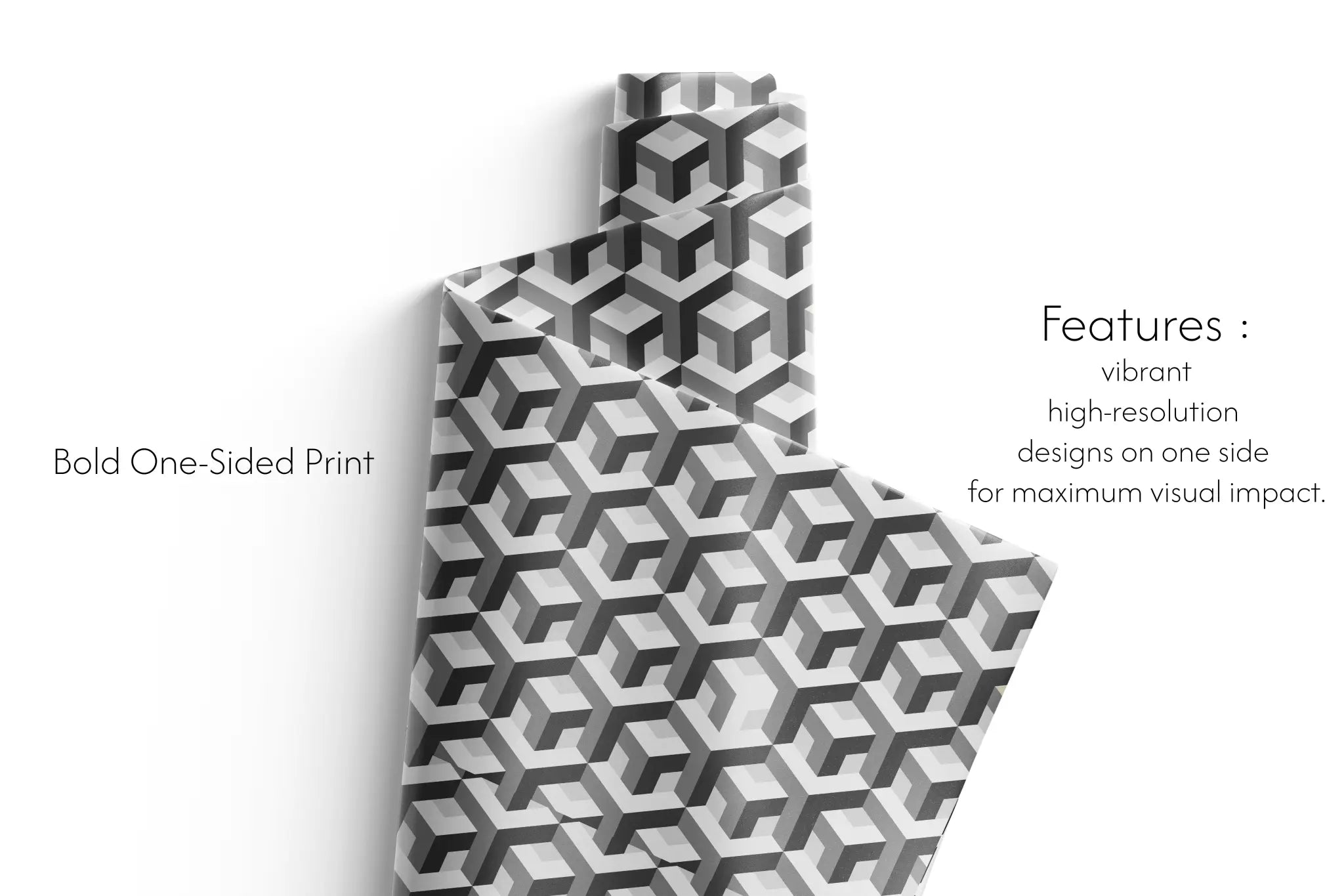 Haus of Wrap’s Le Patron gift wrap: striking black-and-white geometric cubes, perfect for birthdays, weddings, or holidays.