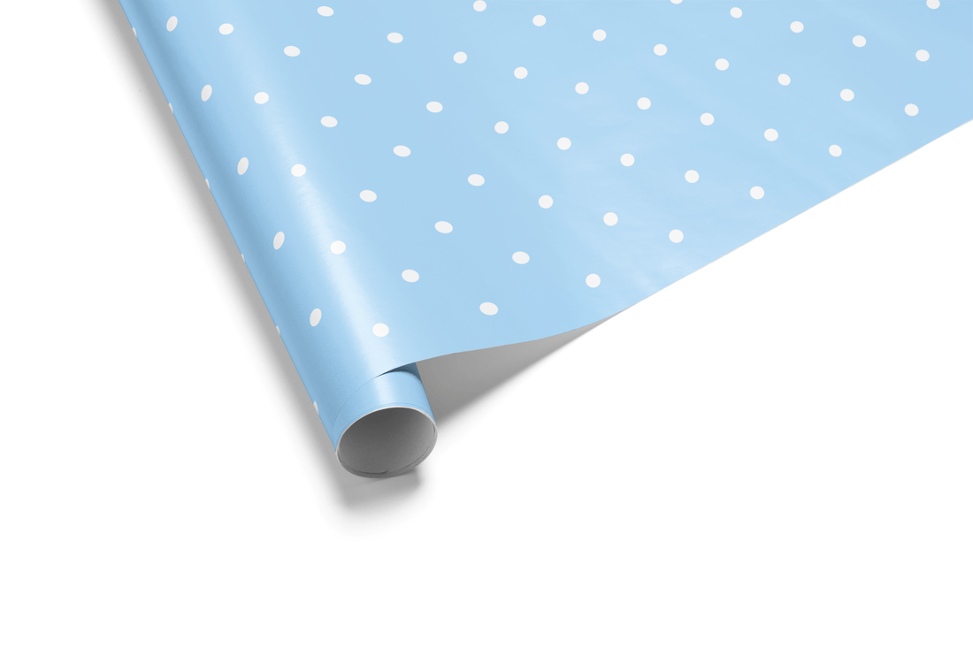 Solid light blue wrapping paper with a uniform pattern of white polka dots, ideal for baby boy wrapping paper and classic, simple gifts.