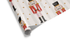 White Christmas wrapping paper with faint stripes, featuring a watercolor pattern of Nutcracker figures in red and black, along with scattered gold stars.