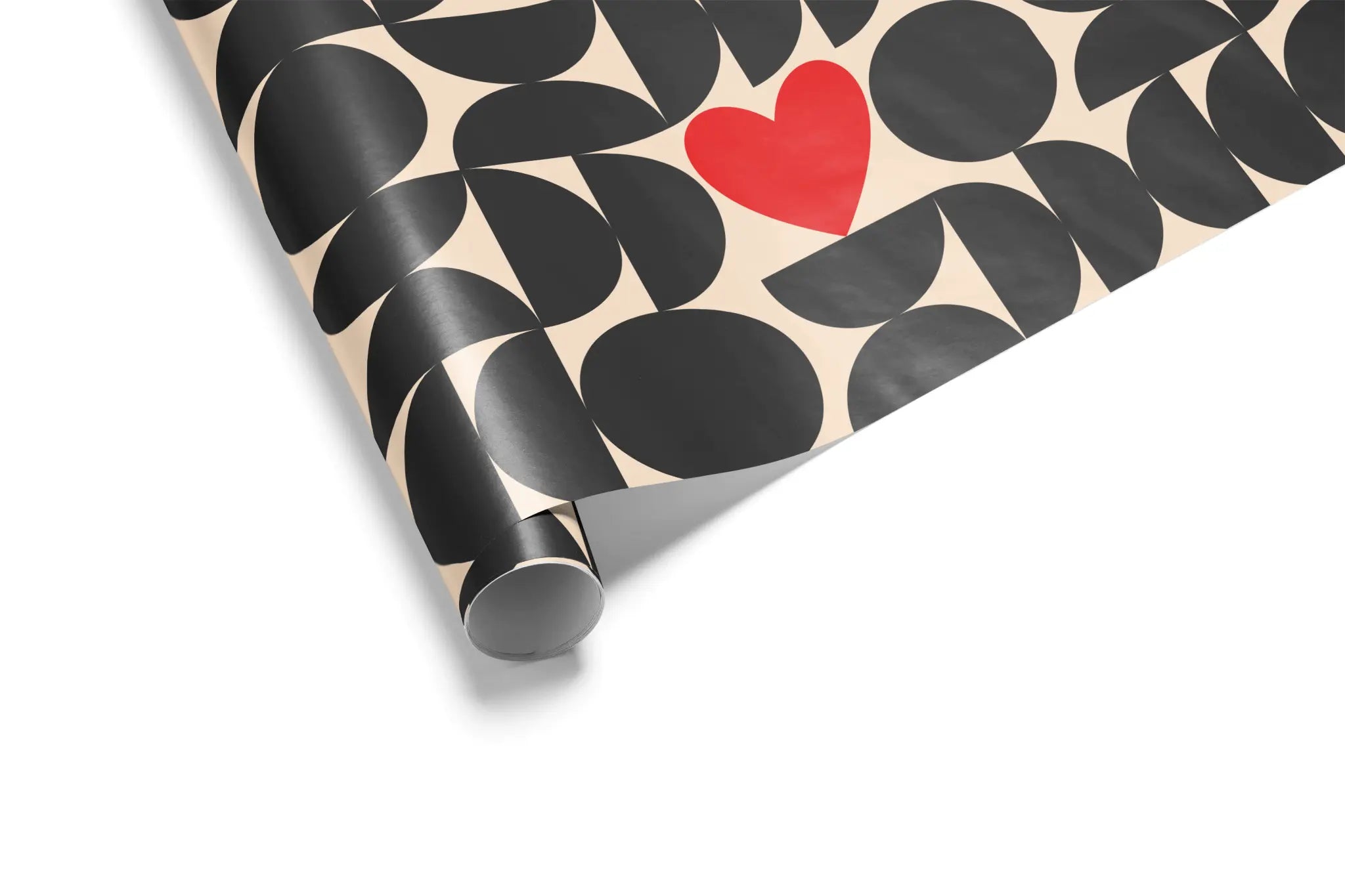 Cream-colored wrapping paper with a black geometric pattern of circles and semi-circles, featuring a single, vibrant red heart motif, ideal for Valentine&