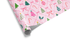 Pink Christmas wrapping paper with festive trees, bows, candy canes, and holly.