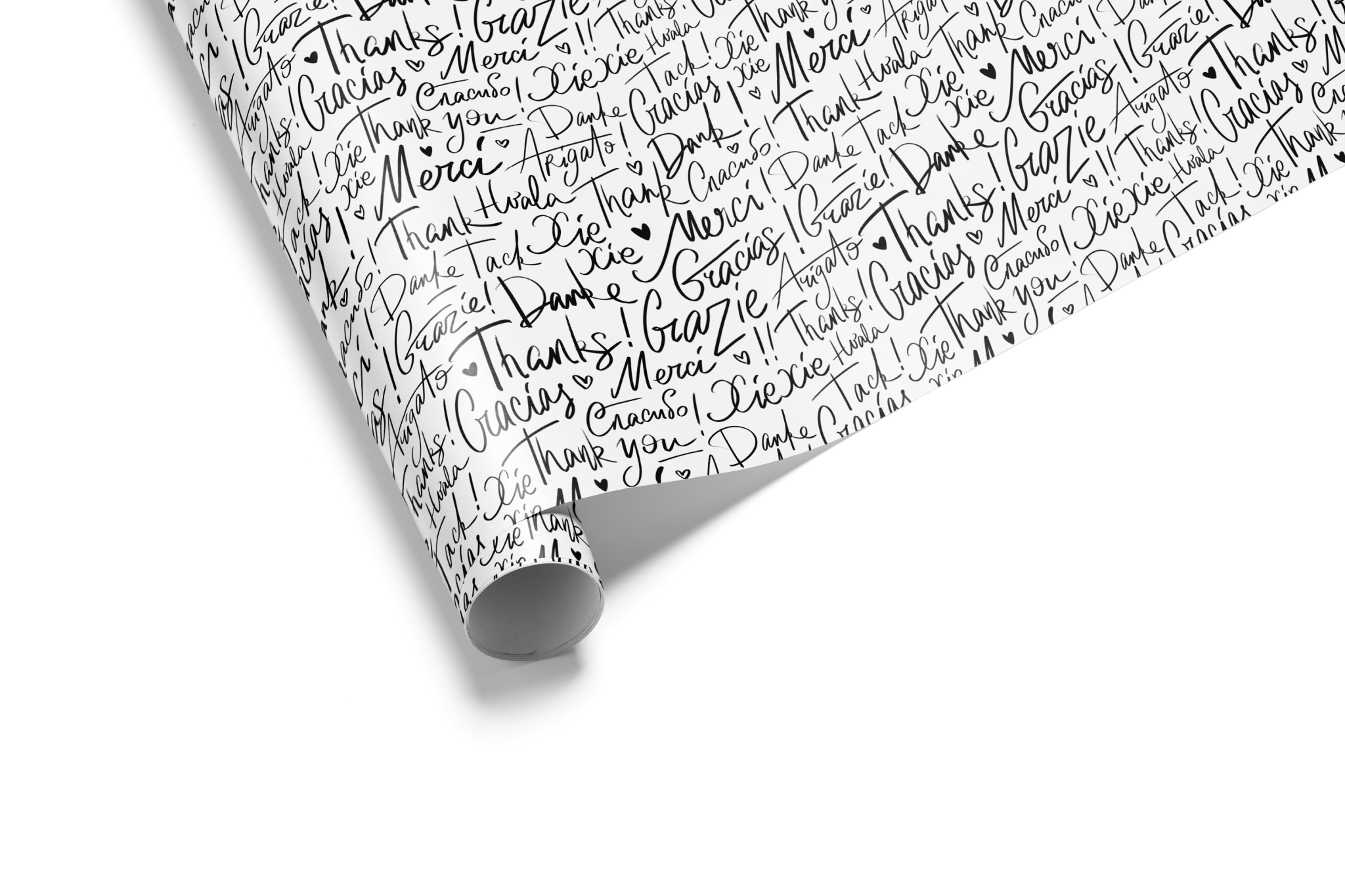 Black-and-white typography wrapping paper with “thank you” in multiple languages.