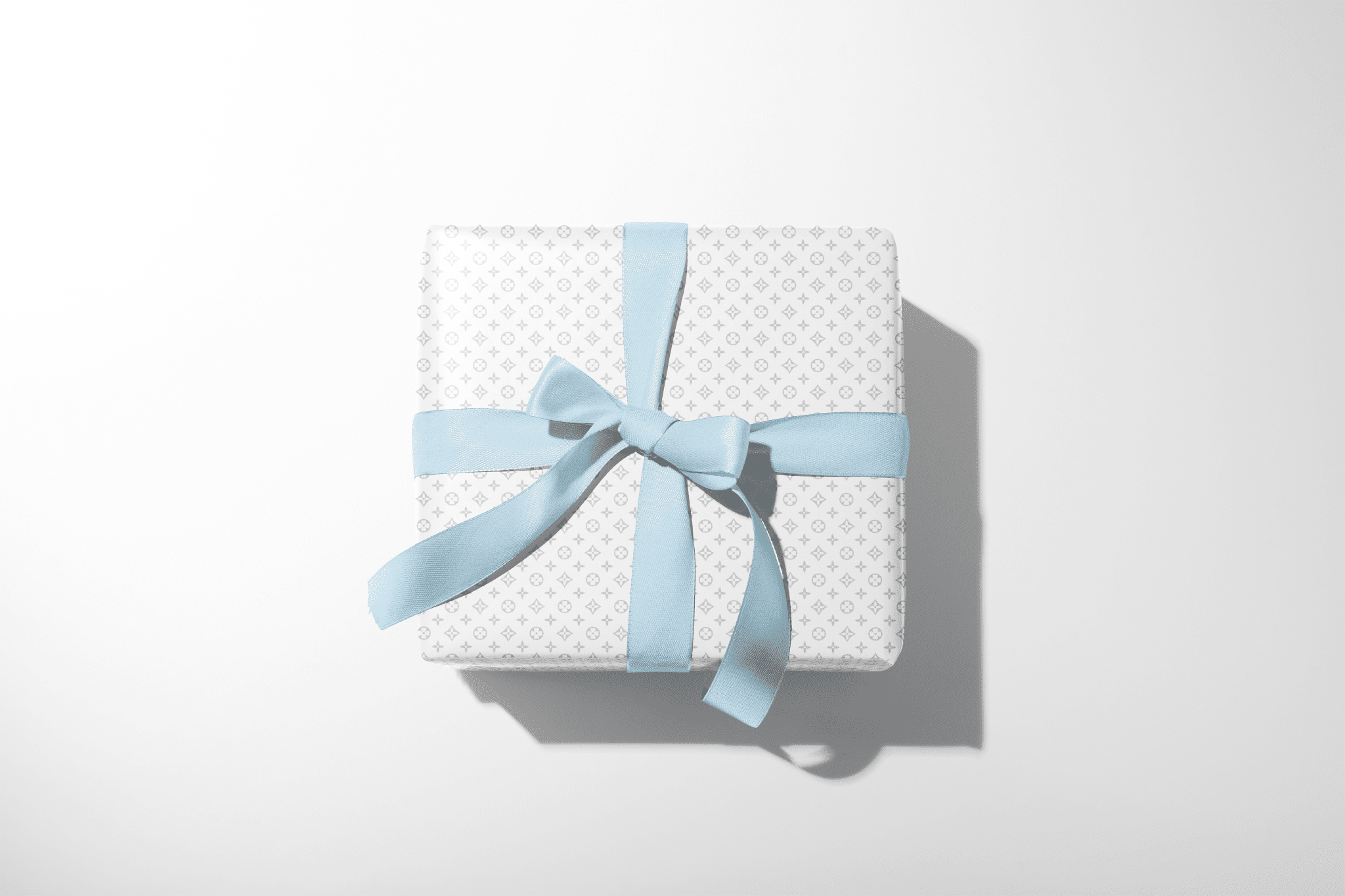 Gift box with a blue ribbon on a white background