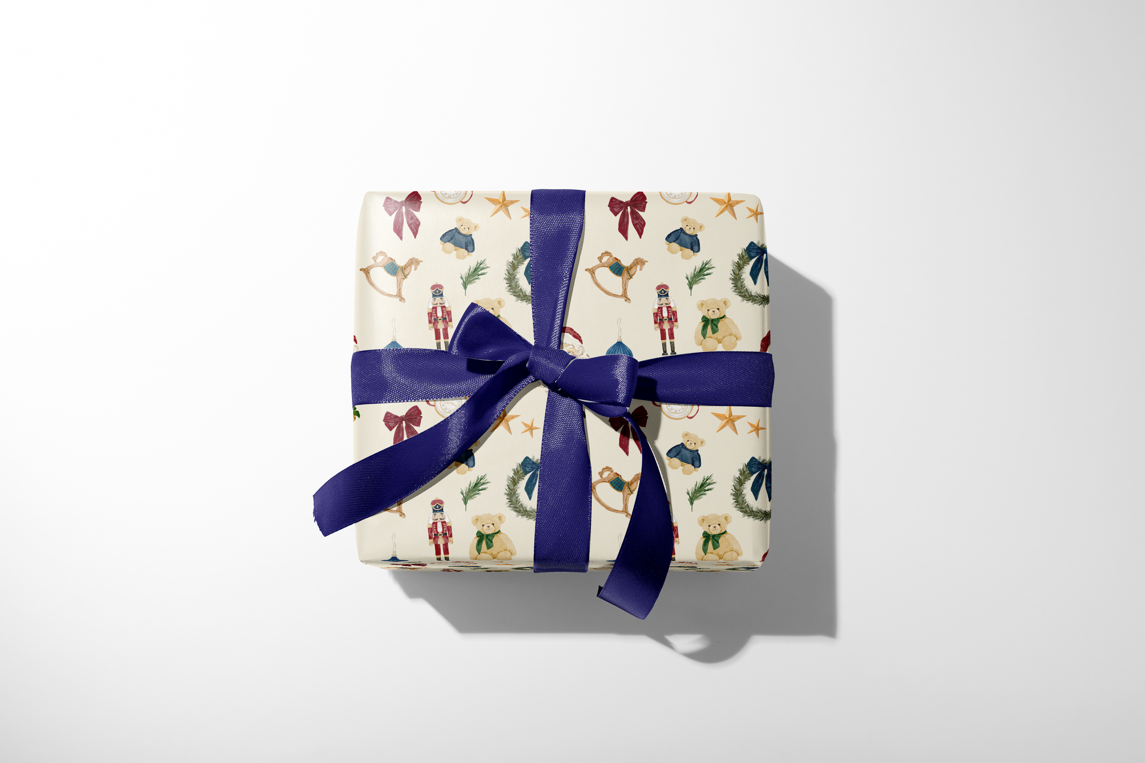 Luxury Christmas Wrapping Paper December Manor gift wrap with Santa nutcracker wreath ornaments gold stars and navy ribbon