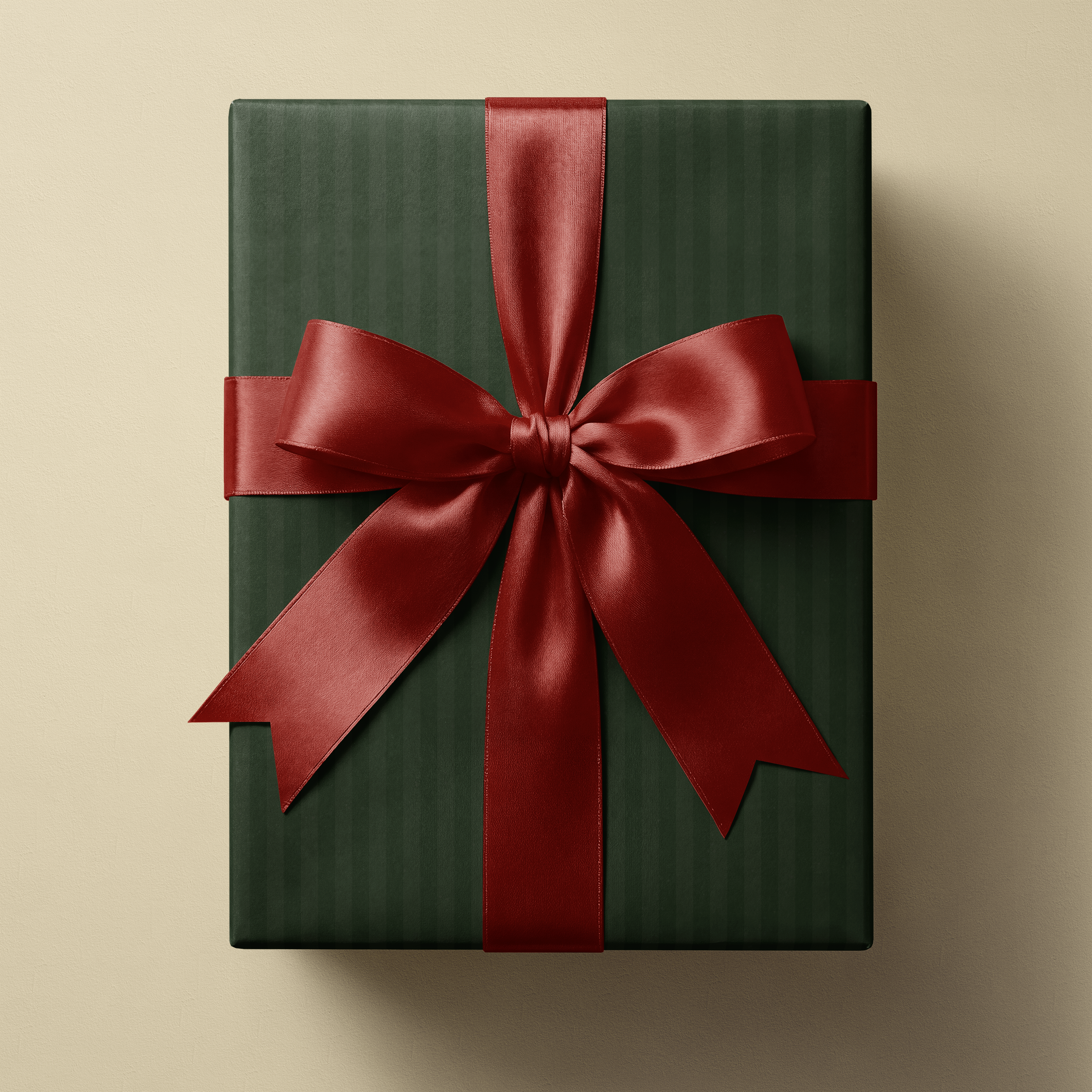 Alt Tag: Green Striped Wrapping Paper Estate Stripe gift wrap with deep forest and muted olive vertical stripes and red satin bow