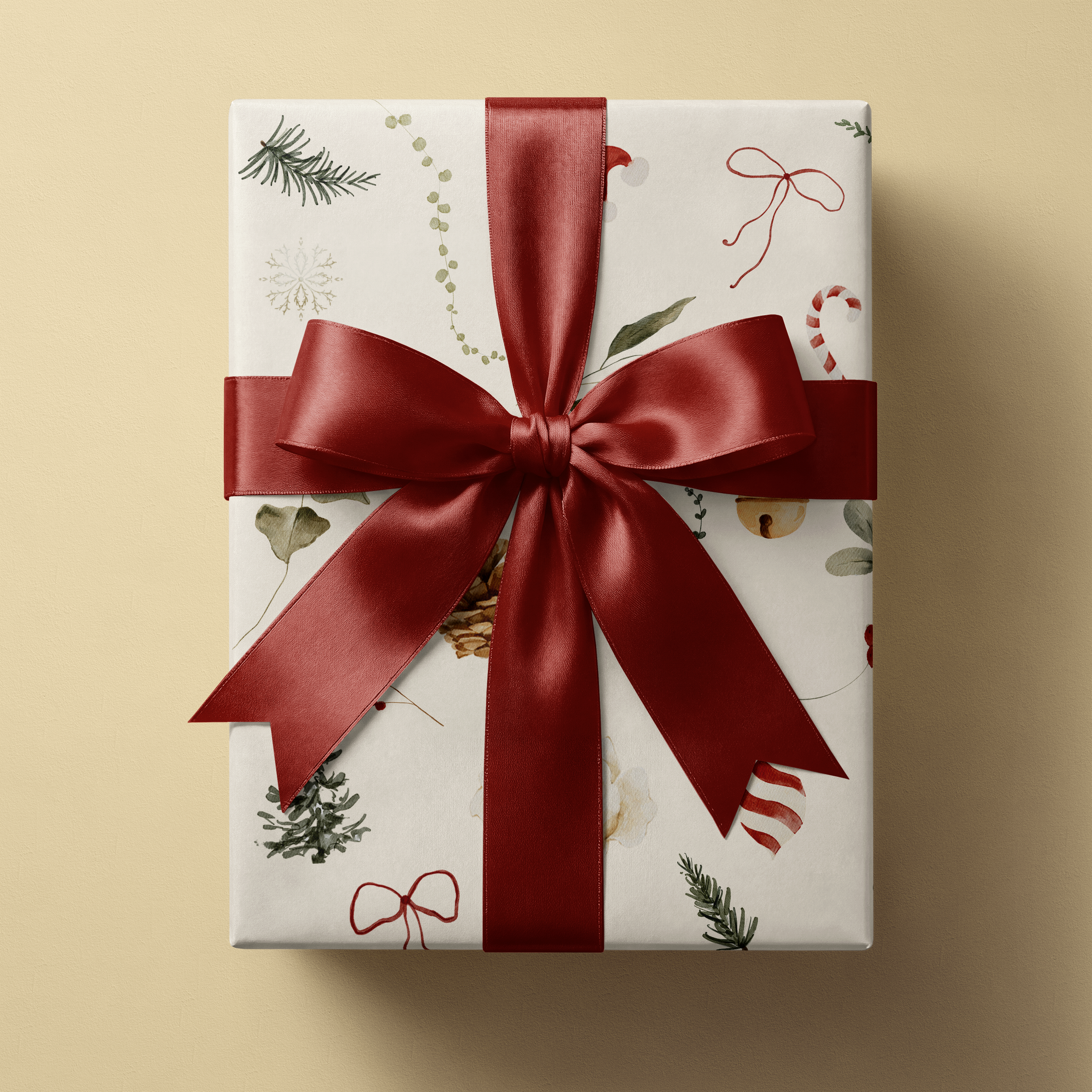 Winter Garden botanical Christmas wrapping paper on gift box with red satin ribbon, watercolor pinecones evergreen holly on cream
