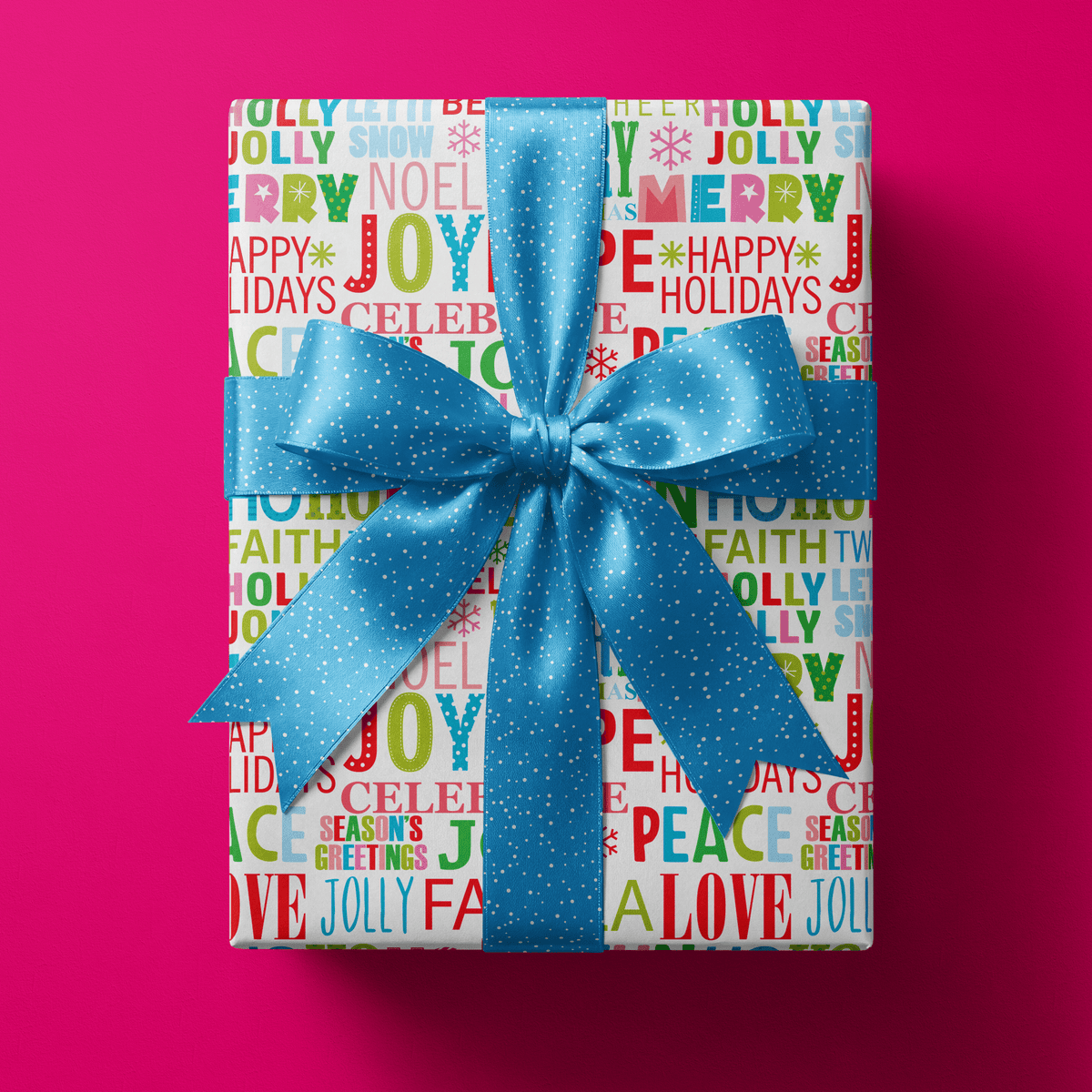 Colorful Christmas wrapping paper packed with festive words like JOY, MERRY and NOEL in bright mixed fonts on white.
