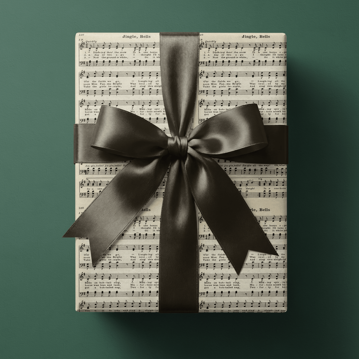 Sheet music gift wrapping paper featuring the vintage carol Jingle, Bells in sepia ink on aged cream paper.