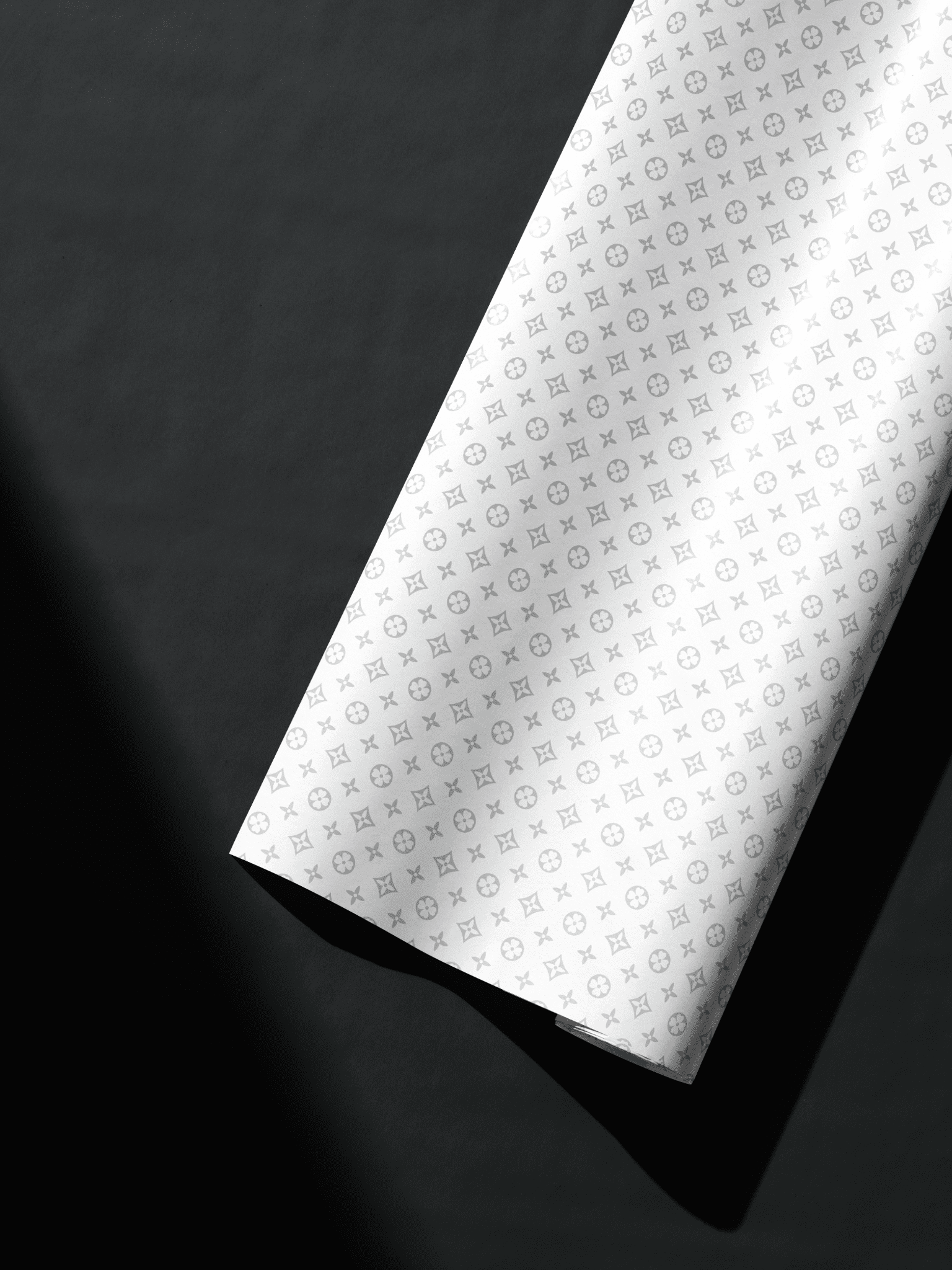 White designer-style monogram gift wrap with grey motifs, ideal for luxury birthday wrapping paper.