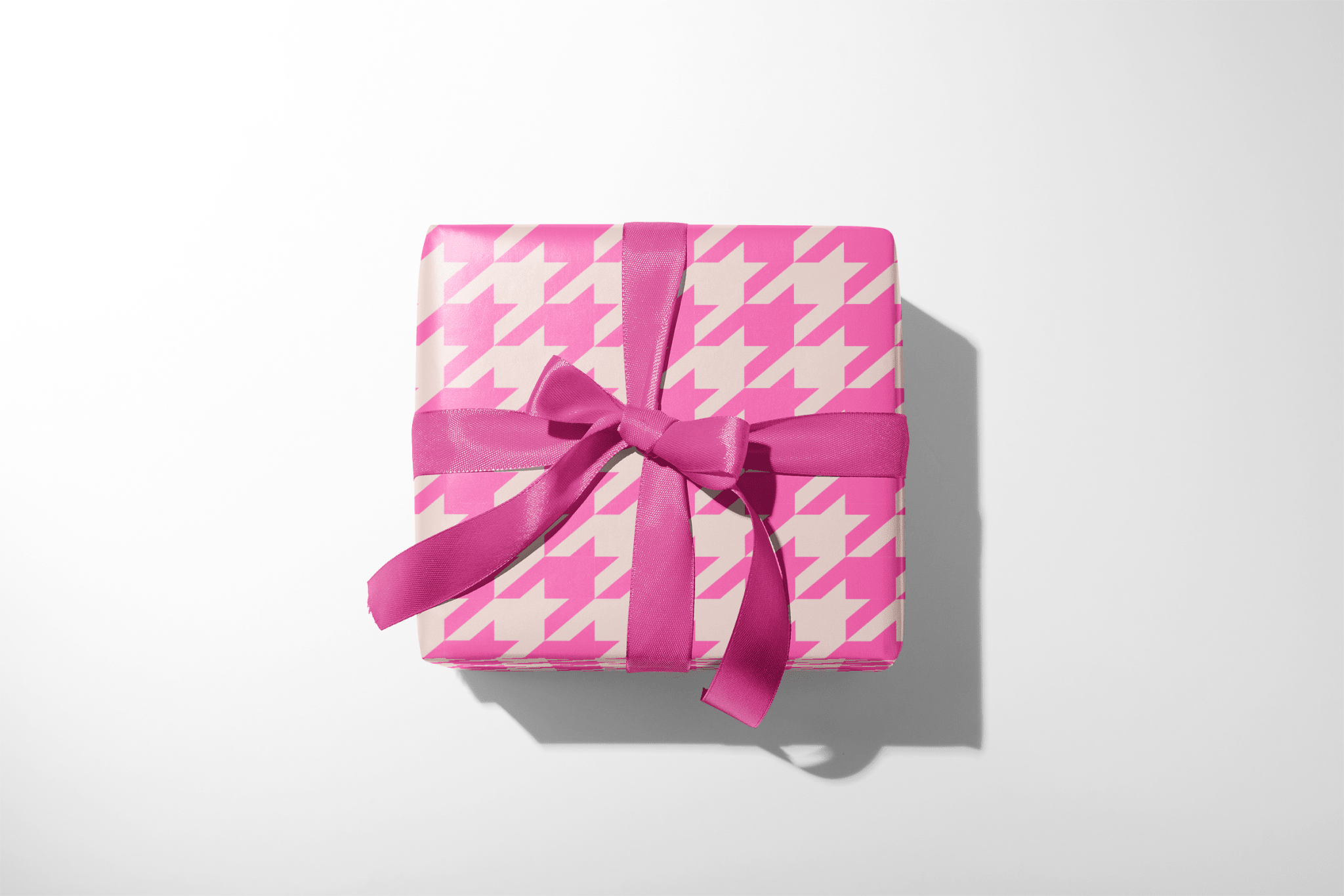 Alt Tag: Pink Houndstooth Barbie Wrapping Paper gift wrap with hot and soft pink houndstooth pattern and satin bow