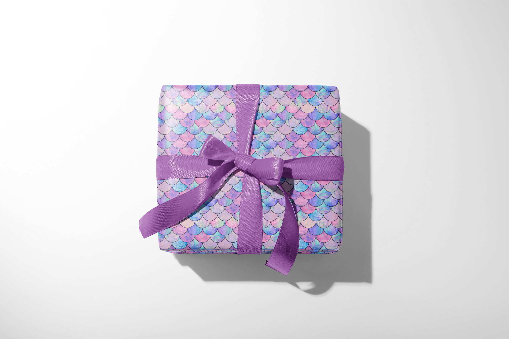 Alt Tag: Opalescent Undersea Brilliance mermaid scales wrapping paper on gift box, childrens wrapping paper for birthday or baby shower
