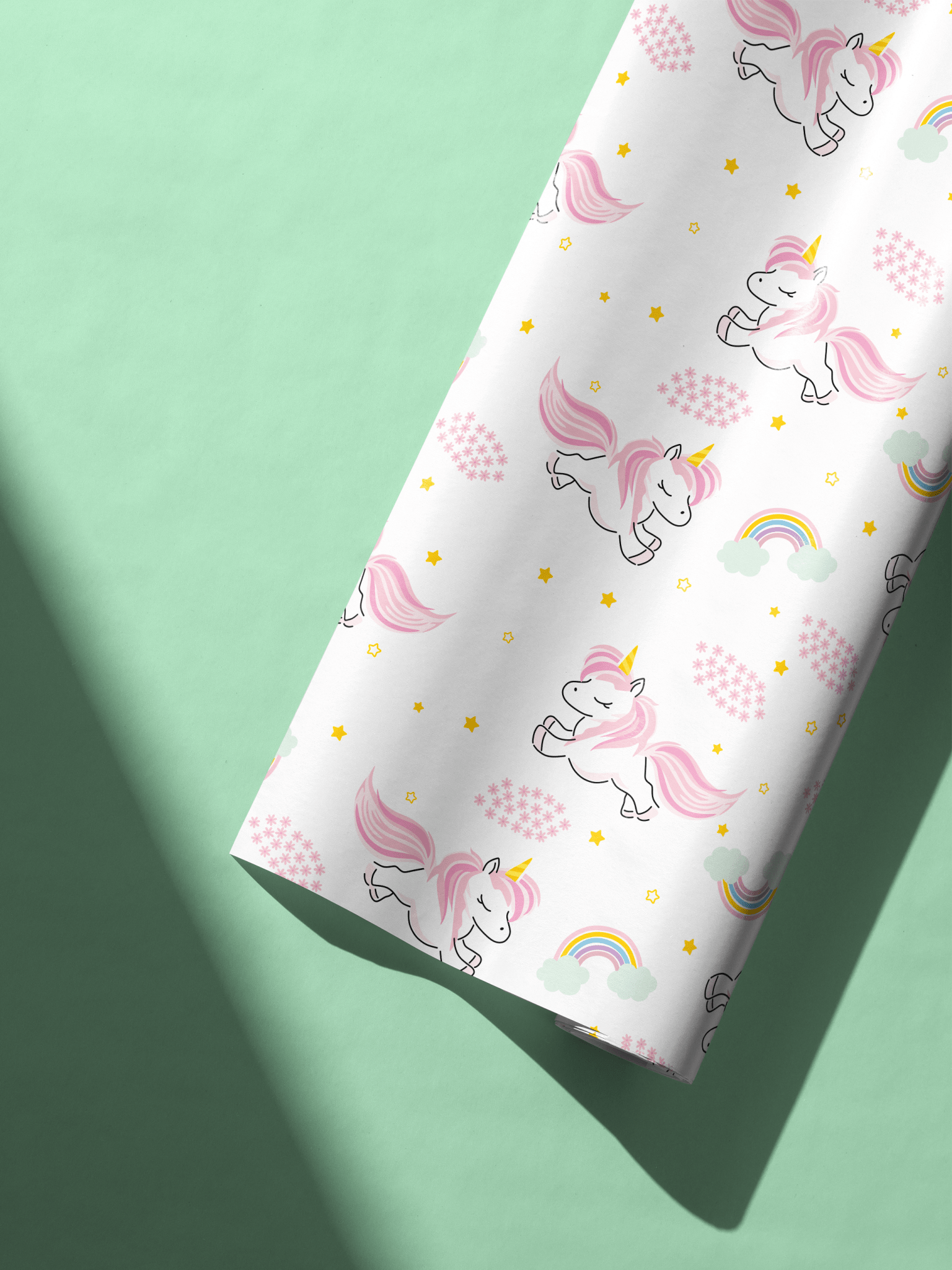 Alt Tag: Unicorn Wrapping Paper with pastel pink unicorns, rainbows, and gold stars on white gift wrap for Sparkle Dream Parade
