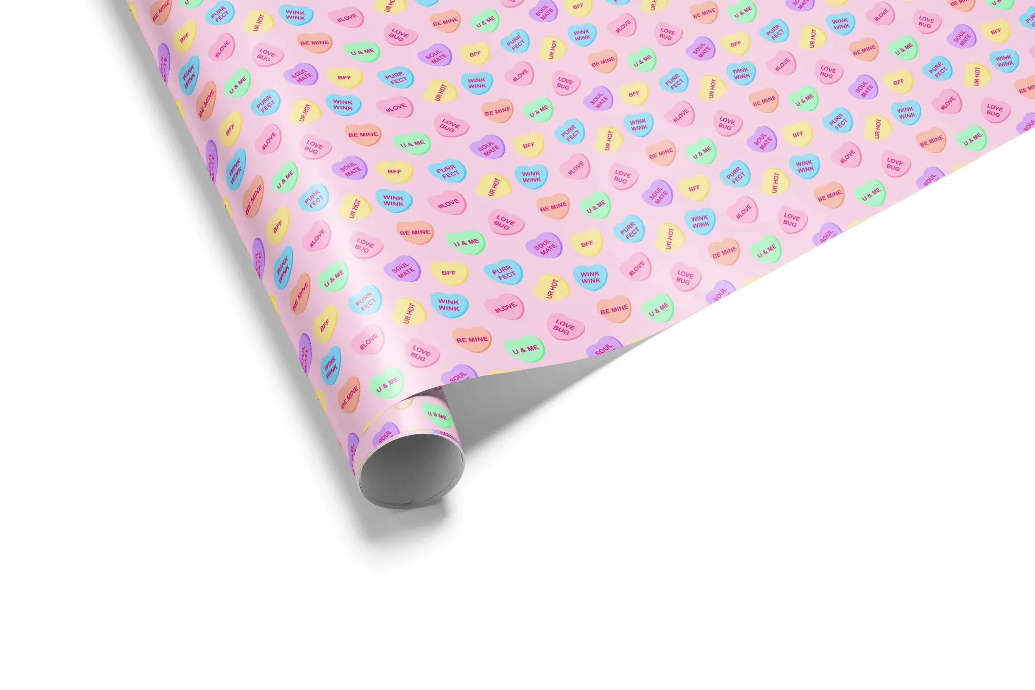 Alt Tag: Pastel Heart Aesthetic Gift Wrapping Paper roll with conversation hearts in mint, lavender, yellow and peach on vibrant pink background