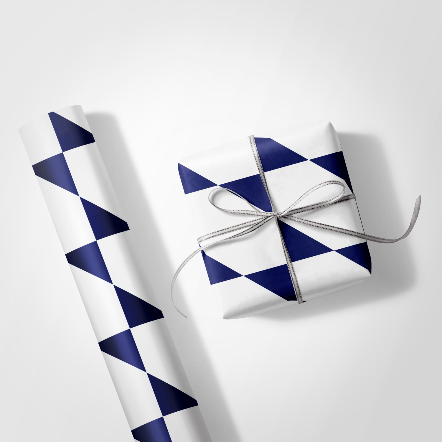 Gift box wrapped in blue and white checkered paper with a silver ribbon on a light gray background.