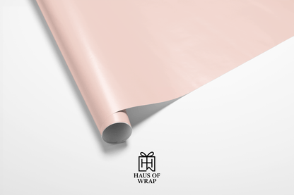 Solid pale pink wrapping paper swatch, ideal for solid color wrapping paper and creating an elegant, subtle background for gifts.