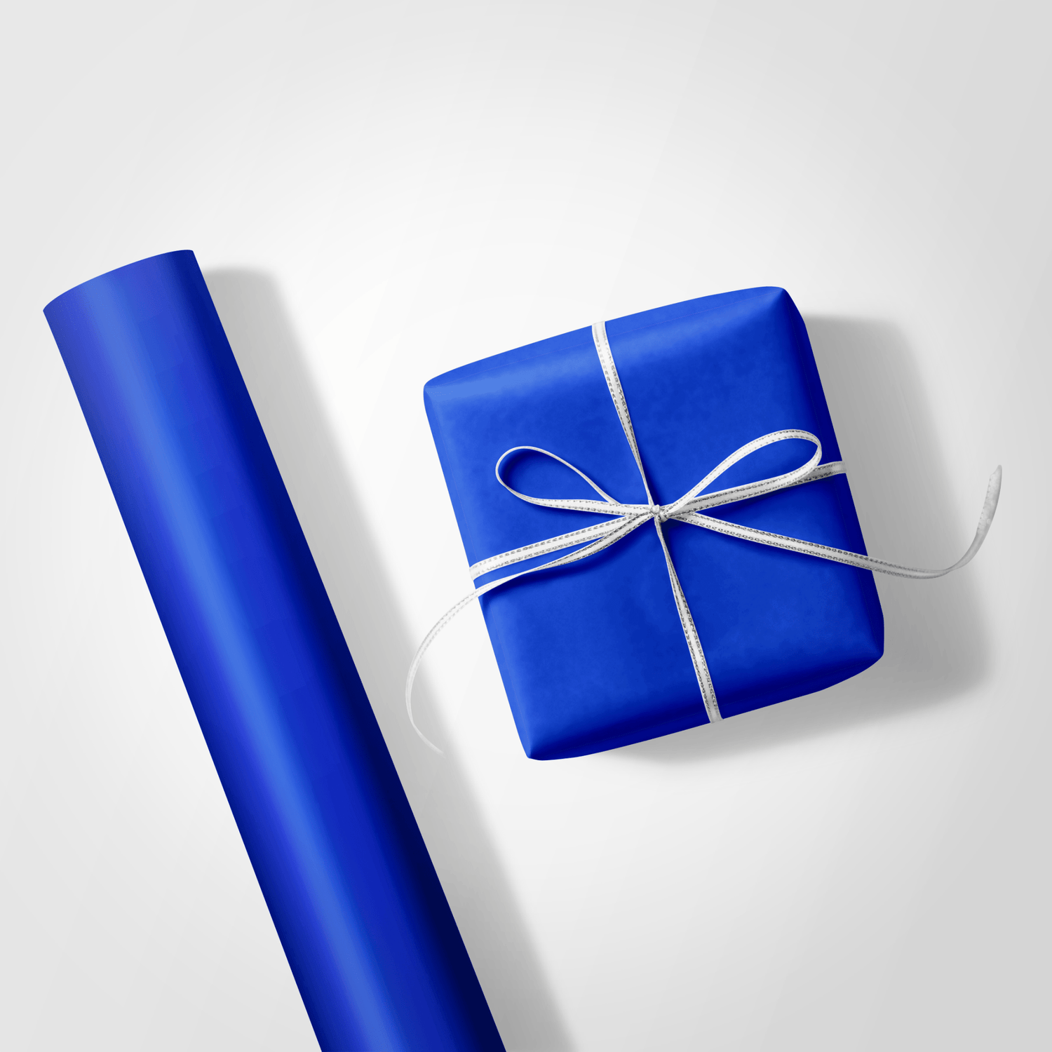 Blue gift wrap with a wrapped present on a white background