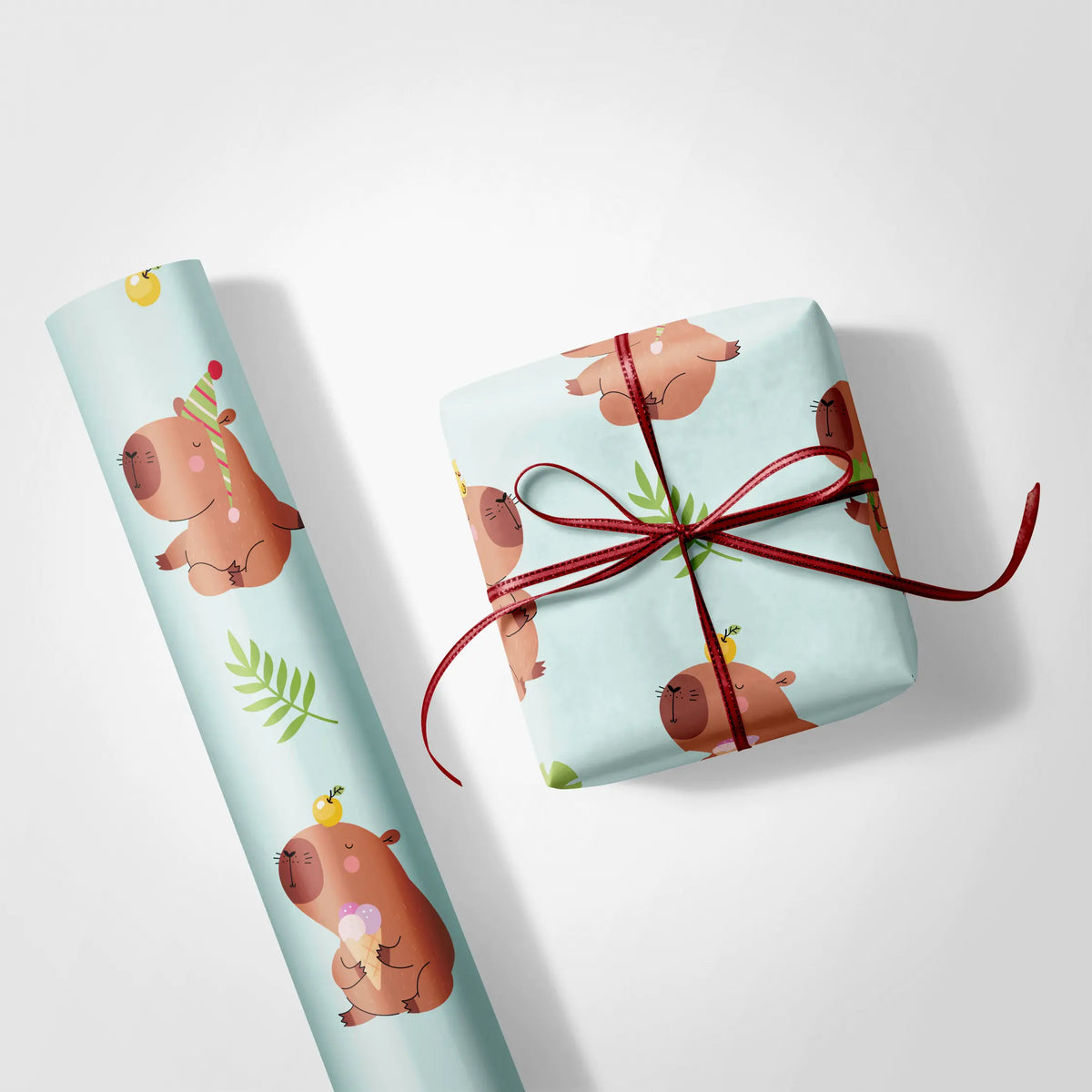 Alt Tag: Cute Birthday Wrapping Paper with cerulean capybara and green botanica pattern on gift box and roll