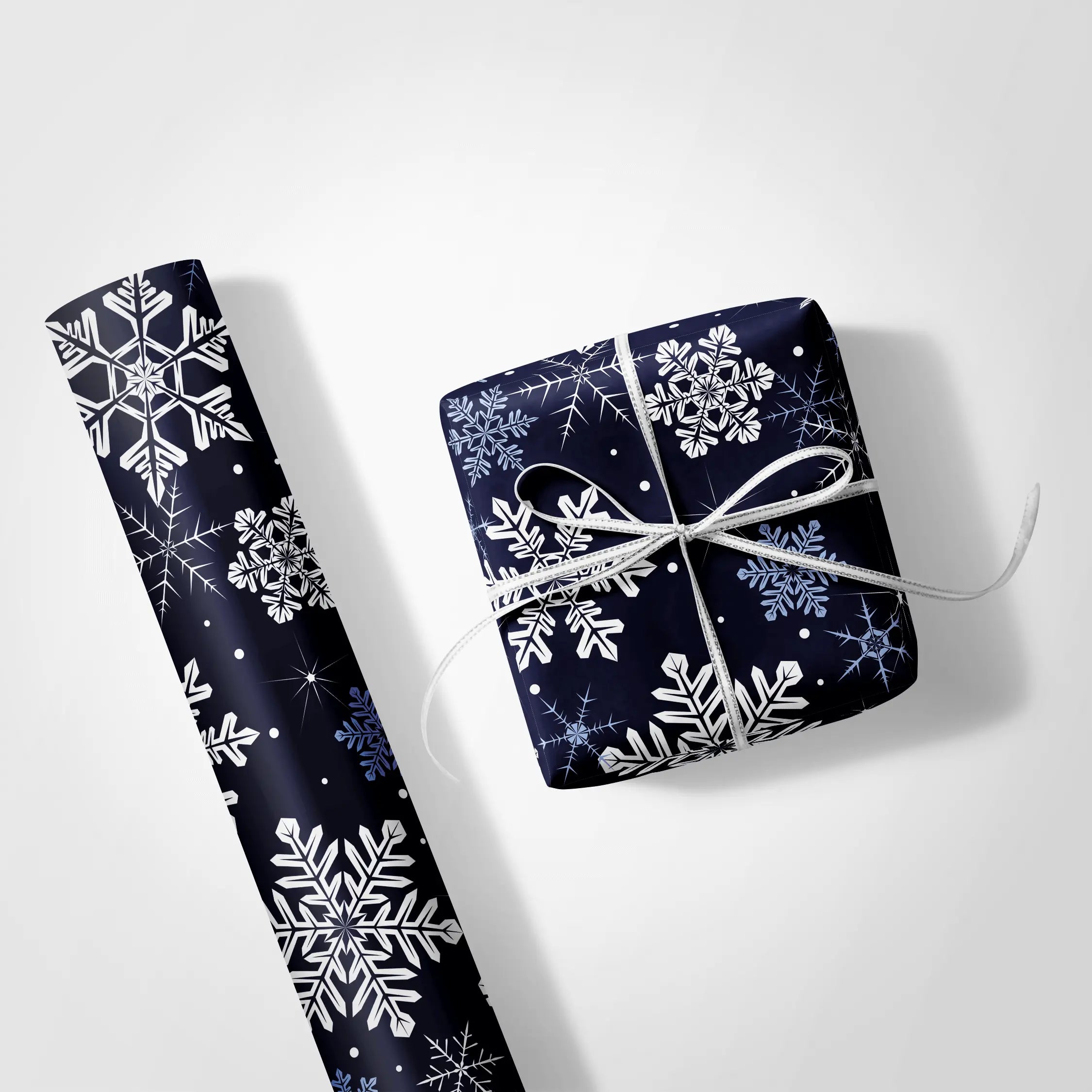 Haus of Wrap Deep Freeze navy snowflake gift wrap, perfect for holidays, birthdays, and weddings, styled on a white background.
