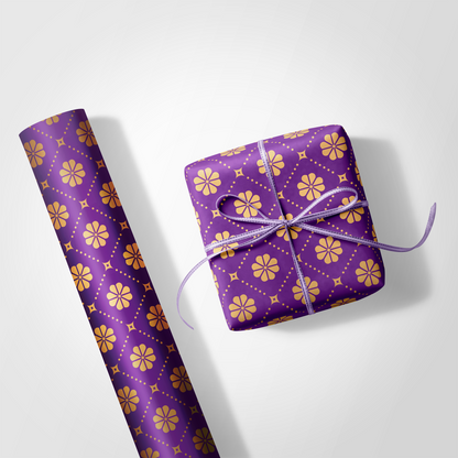 Purple gift wrap with yellow floral pattern and a tied bow on a white background