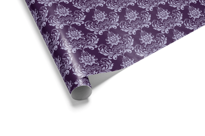 Monochromatic purple wrapping paper with a dense, repeating Damask motif in two shades of purple, conveying a sense of luxury and formal gift wrap.