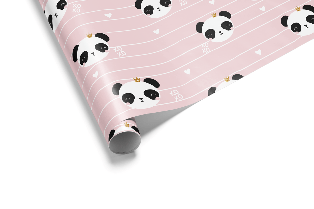 Light pink striped wrapping paper with a pattern of cute panda faces wearing small gold crowns, hearts, and "XO" text, ideal for girly birthday wrapping paper.