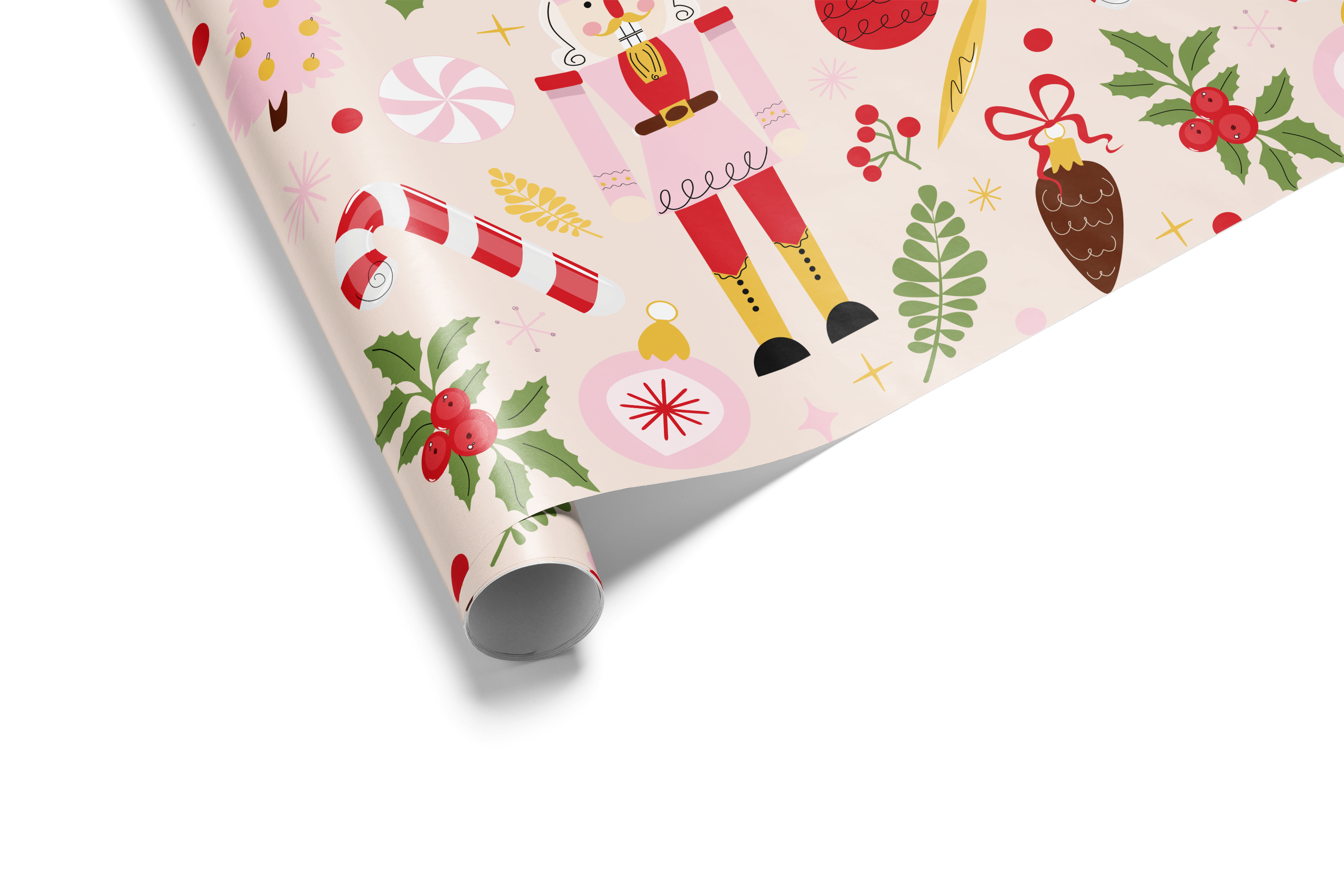 Roll of Christmas-themed wrapping paper with nutcrackers, holly, and candy canes on a light pink background.
