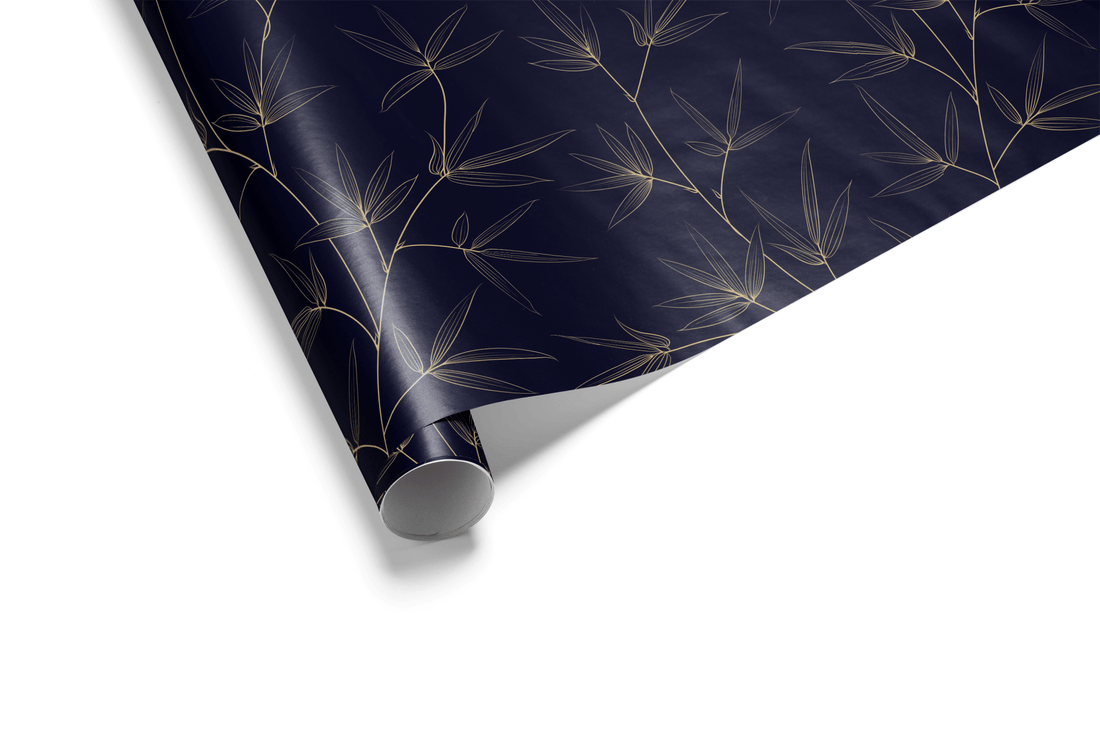Dark navy blue wrapping paper with a subtle, fine pattern of gold metallic botanical bamboo or leaves, ideal for luxury and elegant wrapping paper.