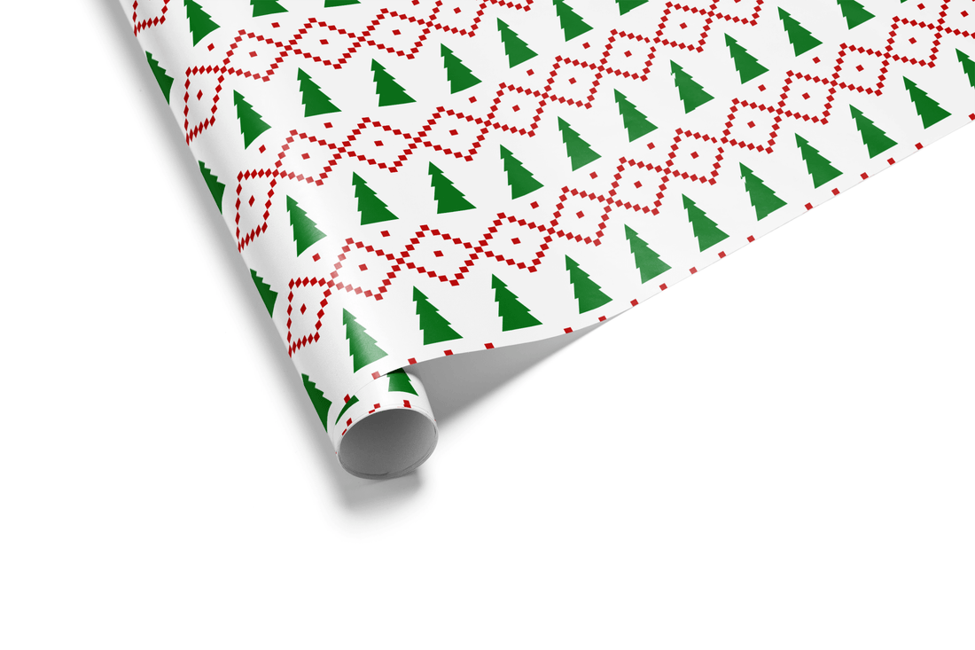 White Christmas wrapping paper with dense bands of red geometric motifs and green Christmas trees, mimicking a knitted Christmas sweater or Fair Isle pattern.