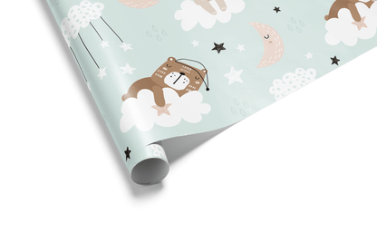 Light blue wrapping paper with a scattered pattern of cartoon teddy bears sleeping on clouds, crescent moons, and stars, ideal for baby shower wrapping paper.