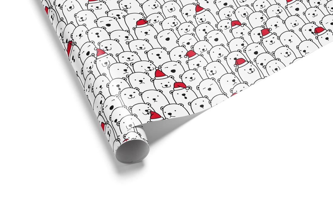 White Christmas wrapping paper with a dense, all-over pattern of black and white cartoon polar bears, many wearing small red Santa hats.