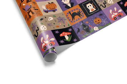 Block-style halloween wrapping paper collage in orange, purple, and black, featuring cartoon skeletons, ghosts, pumpkins, and a cartoon Dracula figure.