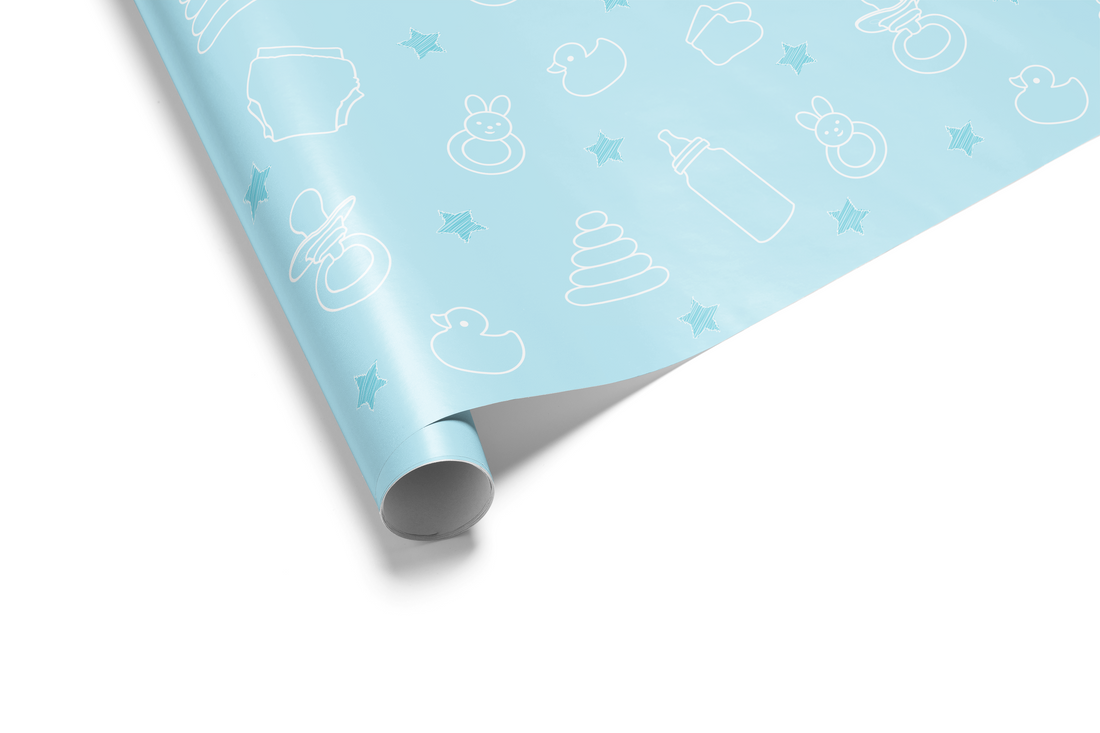 Light blue baby wrapping paper named Cerulean Cradle with a pattern of white line-art baby items like bottles, ducks, and pacifiers, specifically for a baby boy.