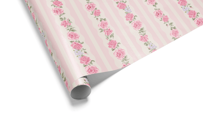 Pink striped wrapping paper featuring elegant vertical garlands of various pink roses and small accent flowers, ideal for feminine and romantic wrapping paper.