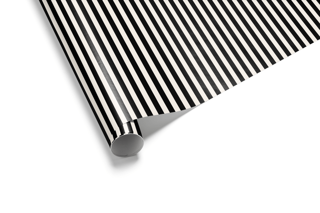 Vertical striped wrapping paper with narrow, alternating black and white lines, creating a classic pinstripe pattern, ideal for mens wrapping paper and modern wrapping paper.