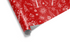 Vibrant red Christmas wrapping paper with a dense white pattern of gift boxes, Christmas trees, and snowflakes, giving a festive, classic look.