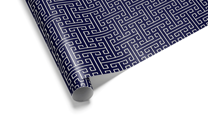 Dense navy blue wrapping paper with a repeating white Greek Key or Meander geometric pattern, creating an intricate maze design, ideal for luxury gift wrap.