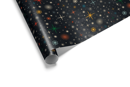 Retro Christmas wrapping paper with colorful starburst patterns on black background.