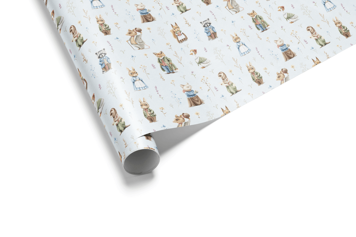 White wrapping paper with a watercolor pattern of storybook woodland animals (rabbits, foxes, hedgehogs) and wildflowers, ideal for peter rabbit wrapping paper.