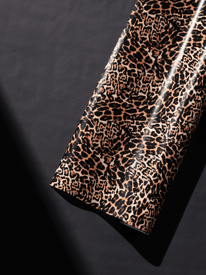 Realistic leopard print gift wrap with tan and black rosettes, perfect for luxury and animal print gifts.