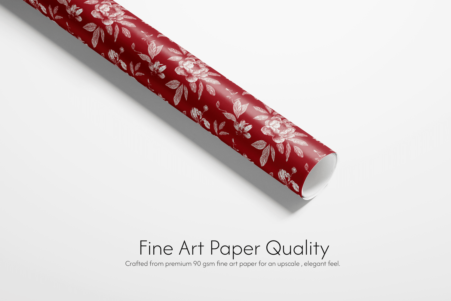 Roll of red paper with floral pattern on a white background