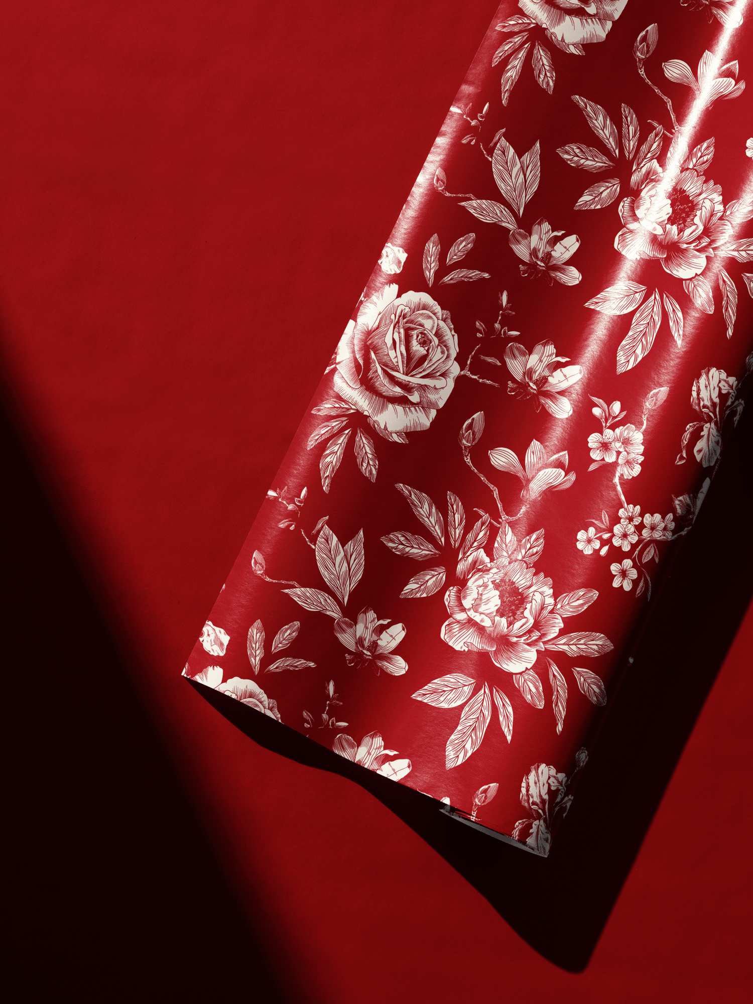 Premium gift wrapping paper in deep red with white floral sketches, ideal for luxury 50th birthday wrapping paper.