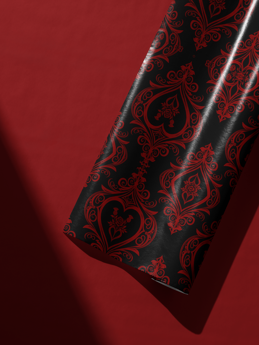Alt Tag: Gothic Gift Wrap in deep black with crimson damask hearts and ornate rose detailing, Dark Devotion design