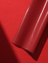 Alt Tag: Red Stripe Wrapping Paper roll with vertical scarlet stripes on red background, tailored polished gift wrap