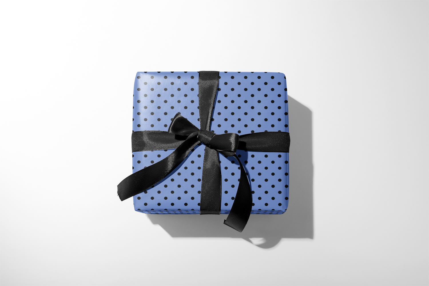 Alt Tag: Blue Polka Dot Wrapping Paper on gift box with black ribbon bow, Midnight Prep modern micro dot design