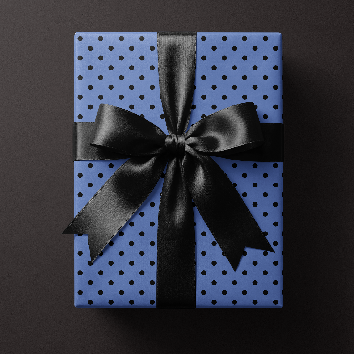 Alt Tag: Blue Polka Dot Wrapping Paper on gift box with black satin ribbon bow, modern minimalist midnight prep presentation