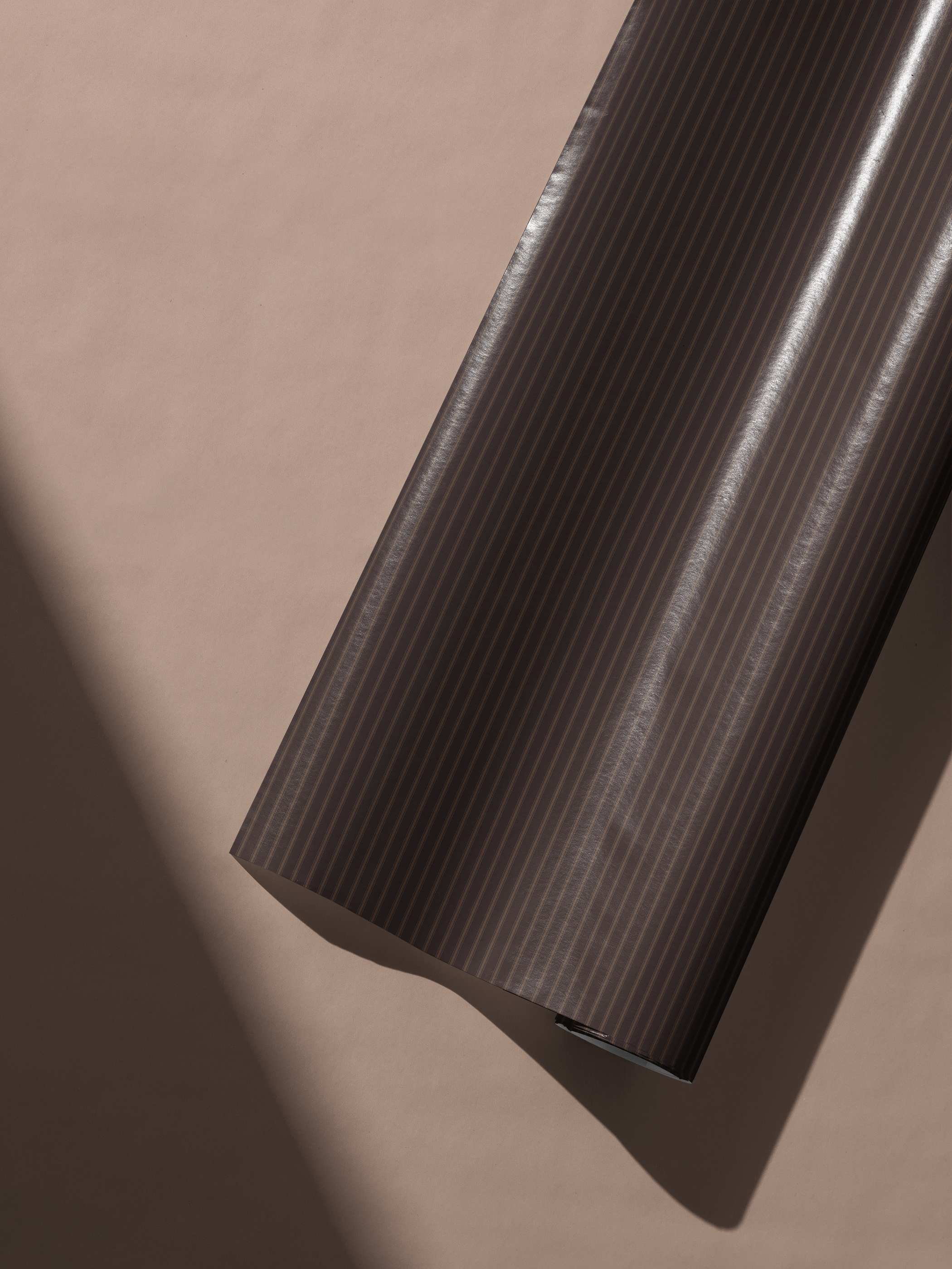 Alt Tag: Brown Striped Wrapping Paper roll in espresso brown with ultra-fine vertical pinstripes, tailored menswear-inspired gift wrap