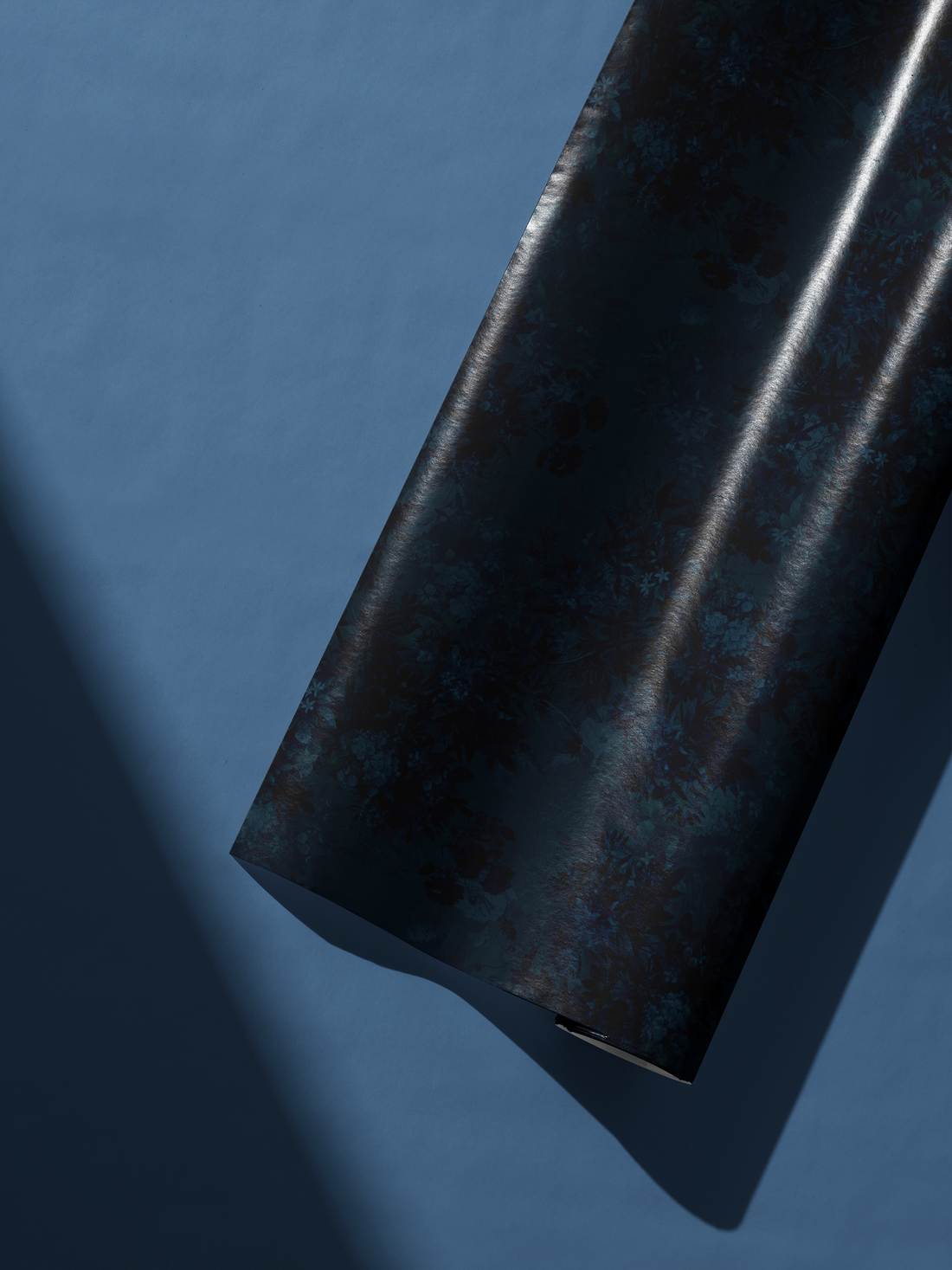 Alt Tag: Dark Floral Wrapping Paper Velvet Nocturne inky navy floral pattern on dark blue roll, romantic evening garden look